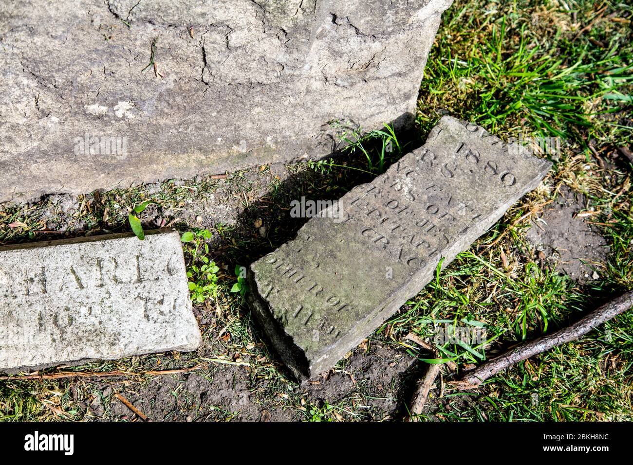 Broken pieces of headstones at former site of Stepney Meeting House Burial Ground (Mercers Burial Ground), London, UK Stock Photo