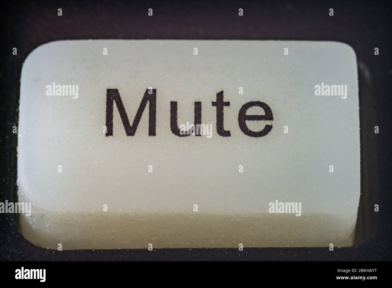 Extreme macro shot of a white mute button on a TV remote Stock Photo ...