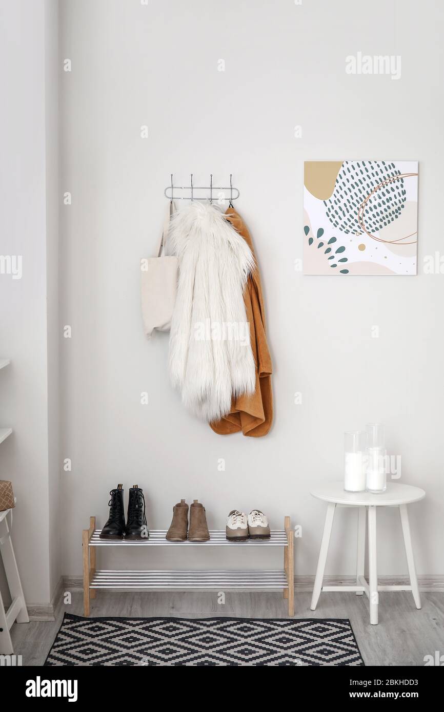 Stylish interior of modern hall with winter clothes Stock Photo - Alamy