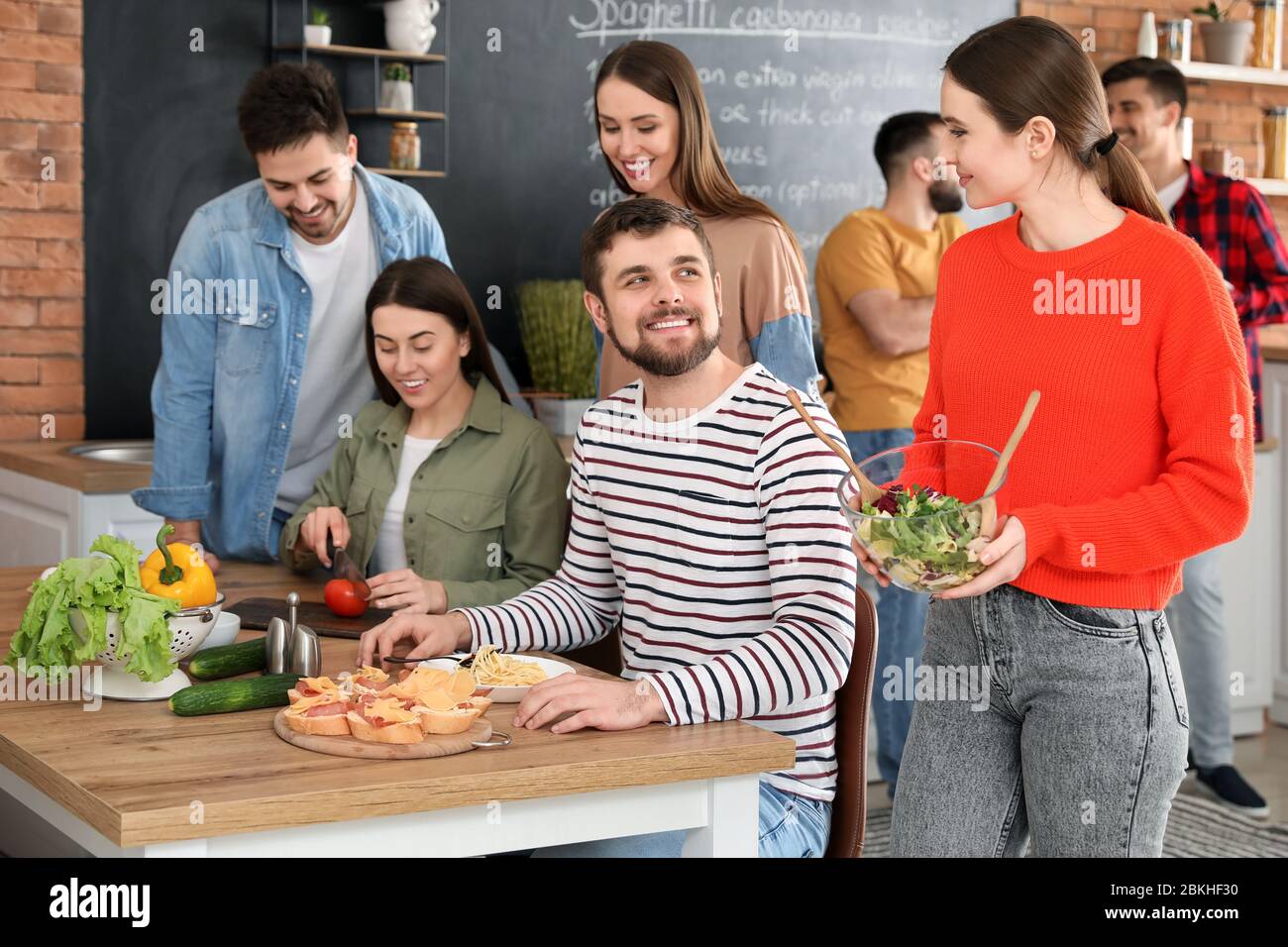 Young friends having dinner hi-res stock photography and images - Alamy