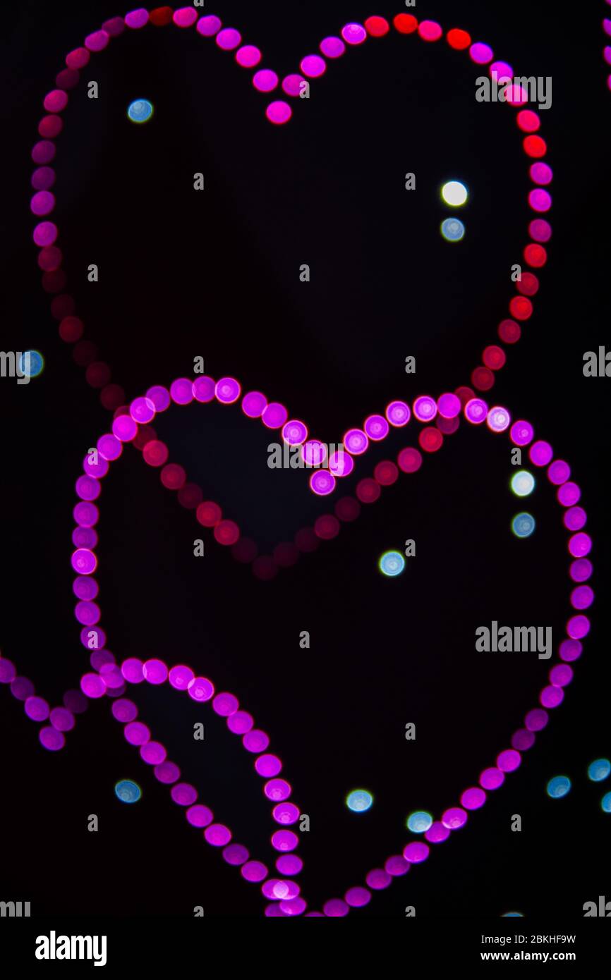A background image of many hearts created by LED lights and the Bokeh ...