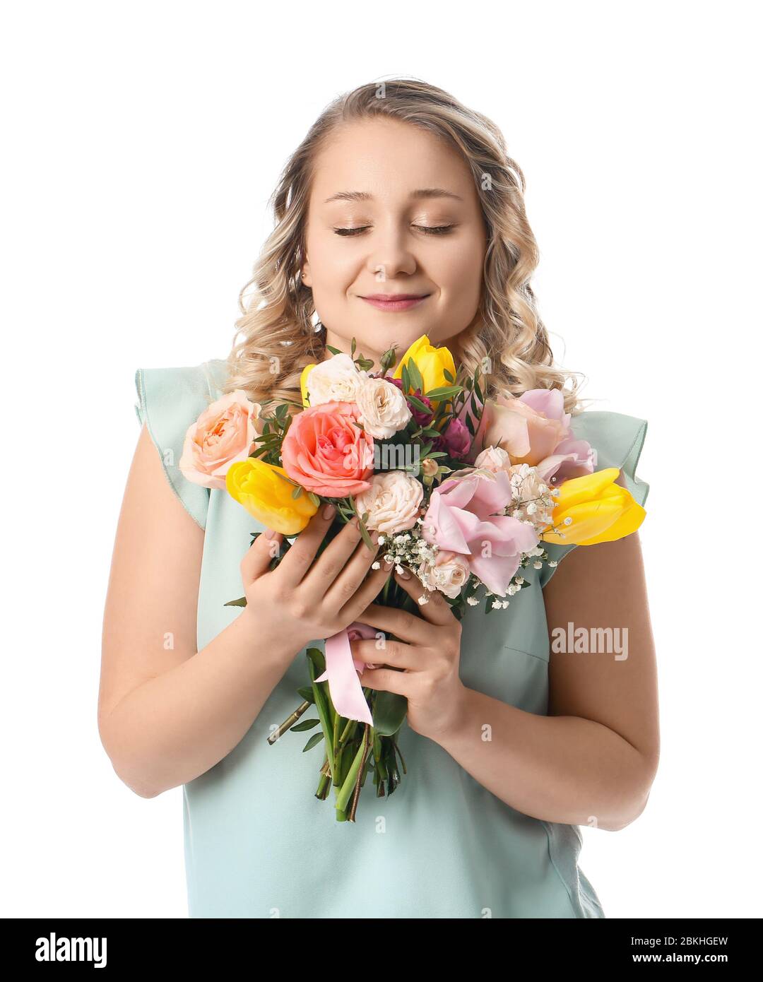 Beautiful young woman with bouquet of flowers on white background Stock ...
