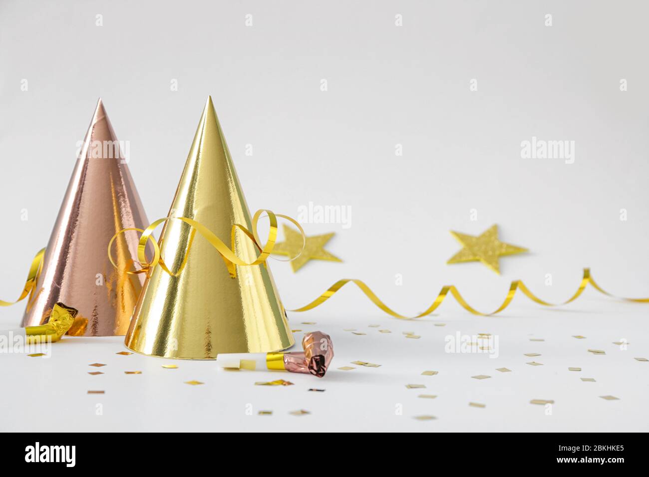 Party hats and decor on white background Stock Photo - Alamy