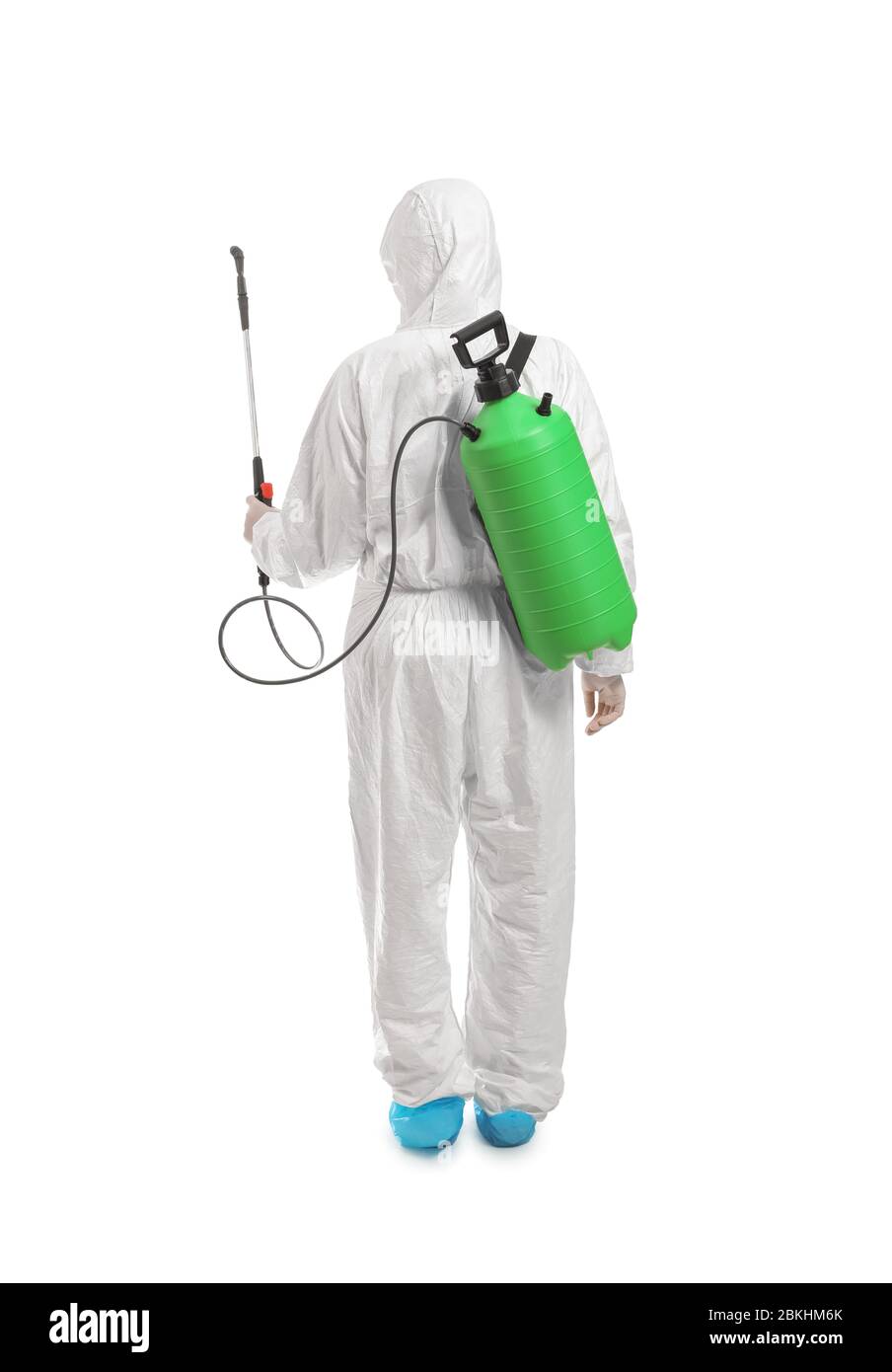 Worker in biohazard suit and with disinfectant on white background Stock Photo