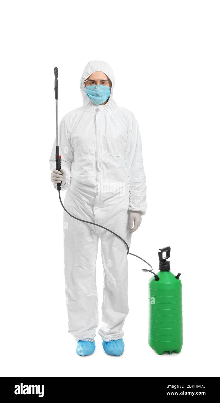 Worker in biohazard suit and with disinfectant on white background Stock Photo
