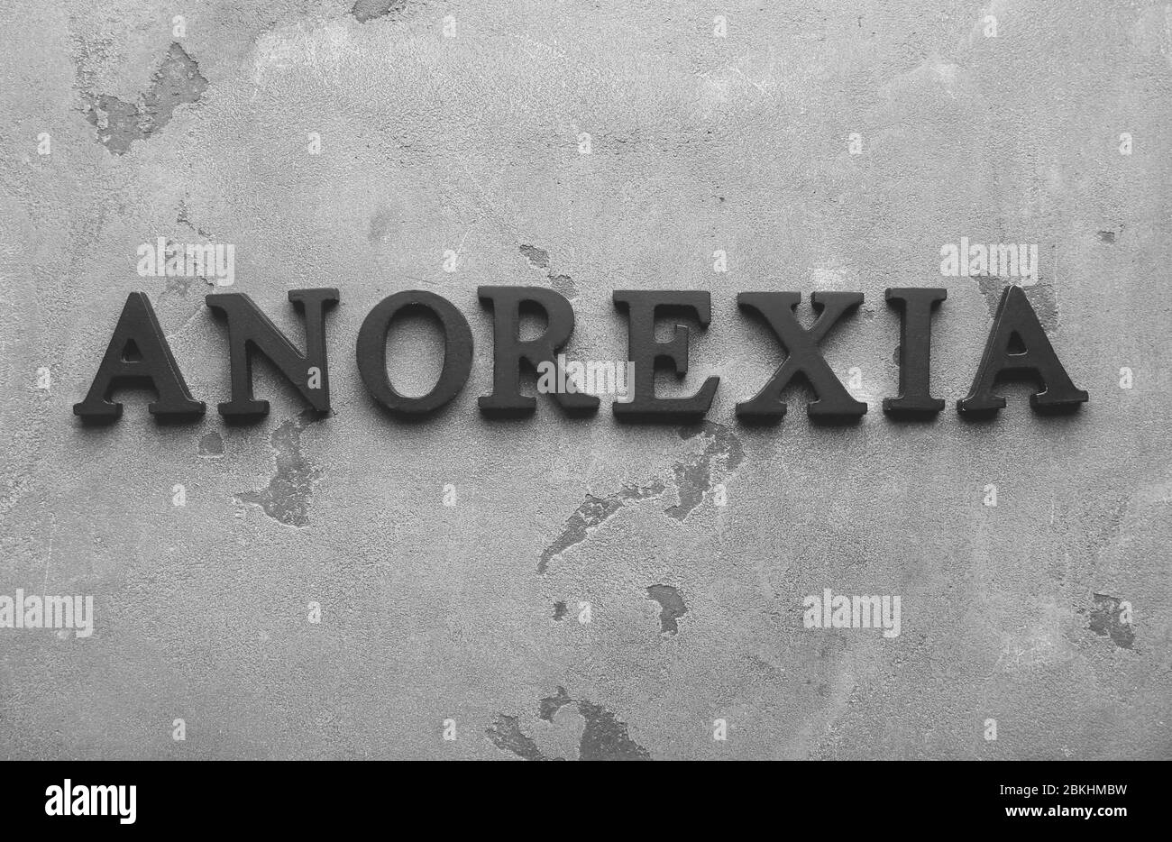 Word ANOREXIA on grey background Stock Photo