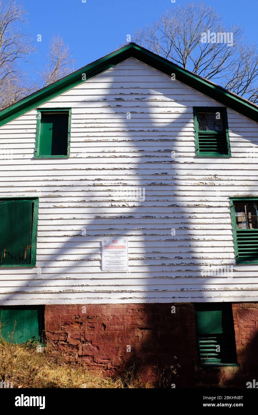 An abandoned house in the deserted village of Feltville with a shadow