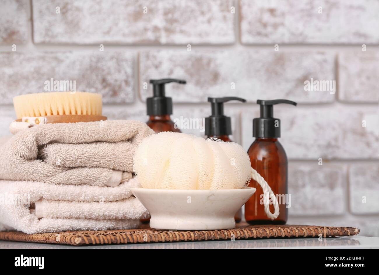 Shower gels, towels and loofah in bathroom Stock Photo Alamy