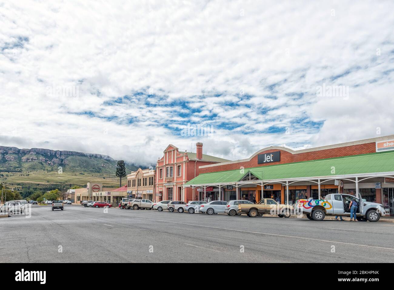 HARRISMITH, SOUTH AFRICA - MARCH 16, 2020:  A street scene, with businesses and vehicles, in Harrismith in the Free State Province Stock Photo
