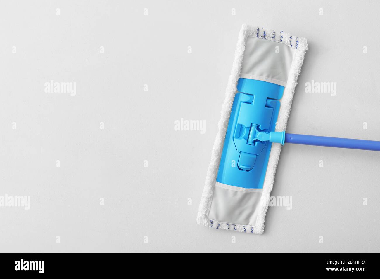 Floor mop on light background Stock Photo