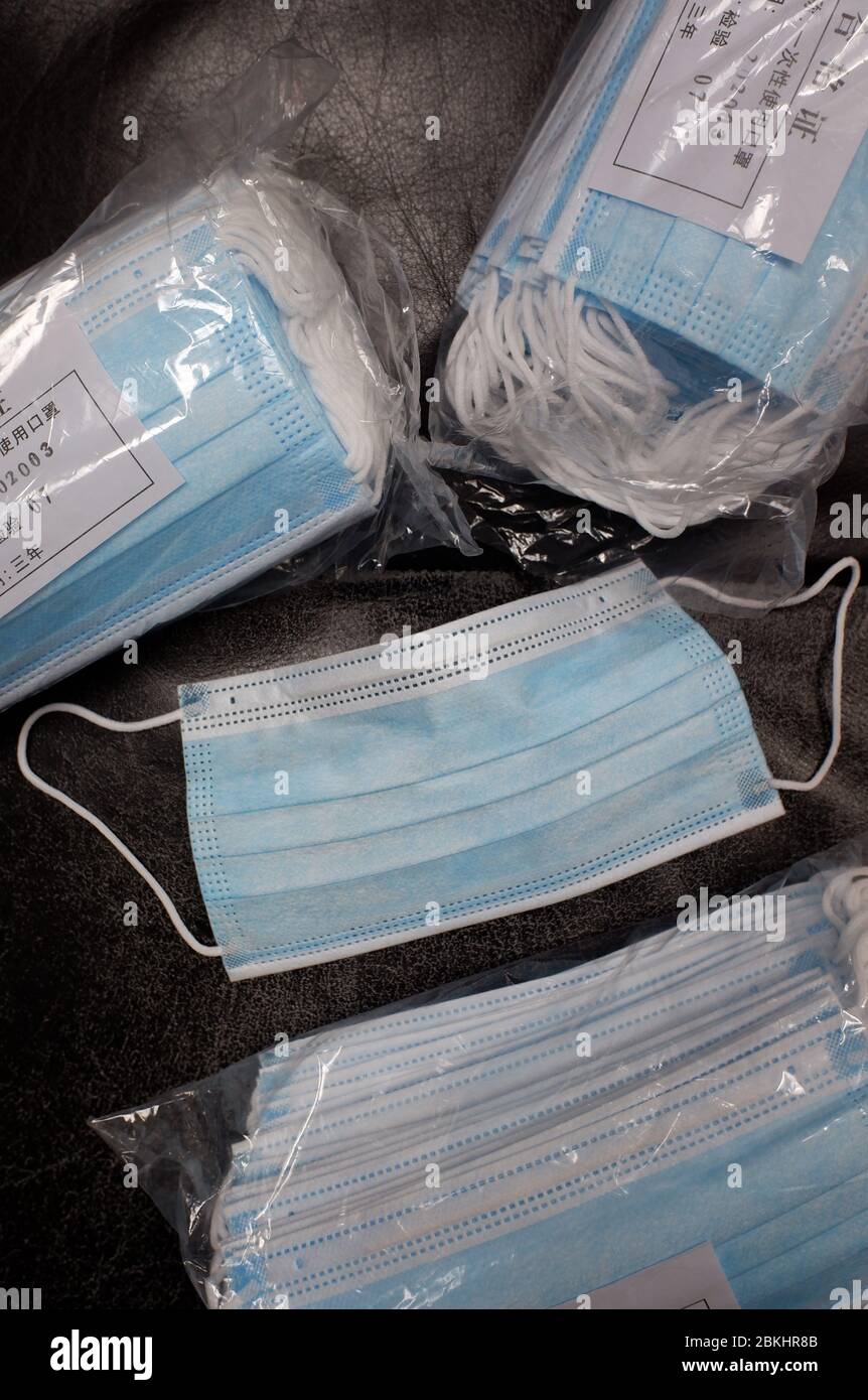 Bundles of Chinese made surgical masks with passed QC label in Chinese.Personal Protective Equipment.during the lockdown of Covid-19. Coronavirus pandemic outbreak in New Jersey.USA Stock Photo