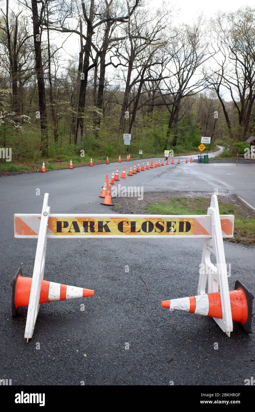 Park closed Roadblock with Park Closed warning sign at the entrance to the deserted Village of Feltville during lockdown of covid-19 coronavirus pandemic outbreak. Watchung Reservation, Berkeley Heights.New Jersey.USA Stock Photo