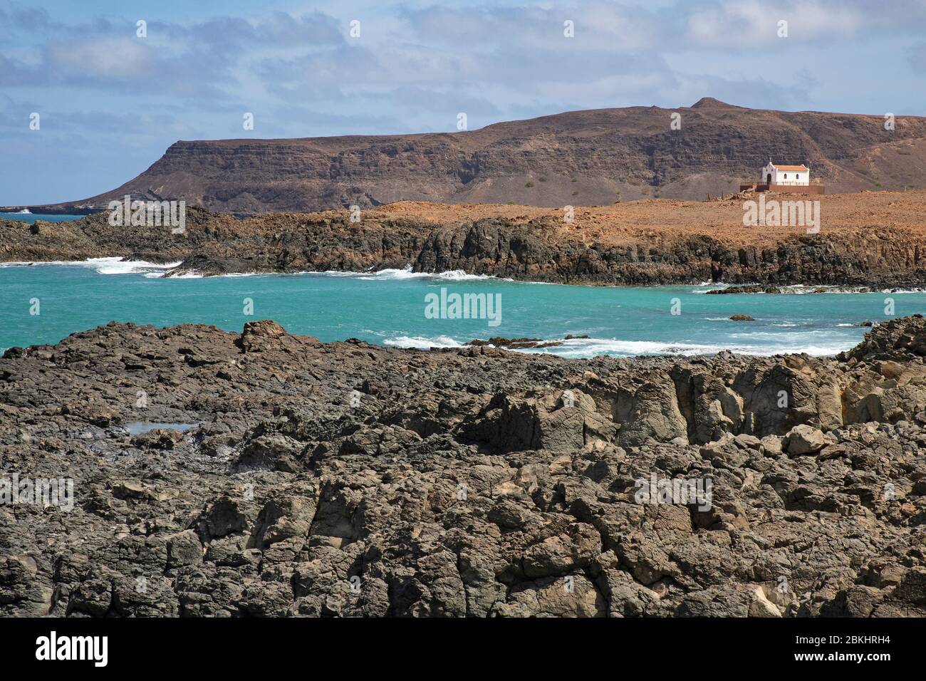 Praia de Fátima and abandoned chapel of Our Lady of Fatima looking over the rugged coast and cliffs near Sal Rei on the island Boa Vista, Cape Verde Stock Photo