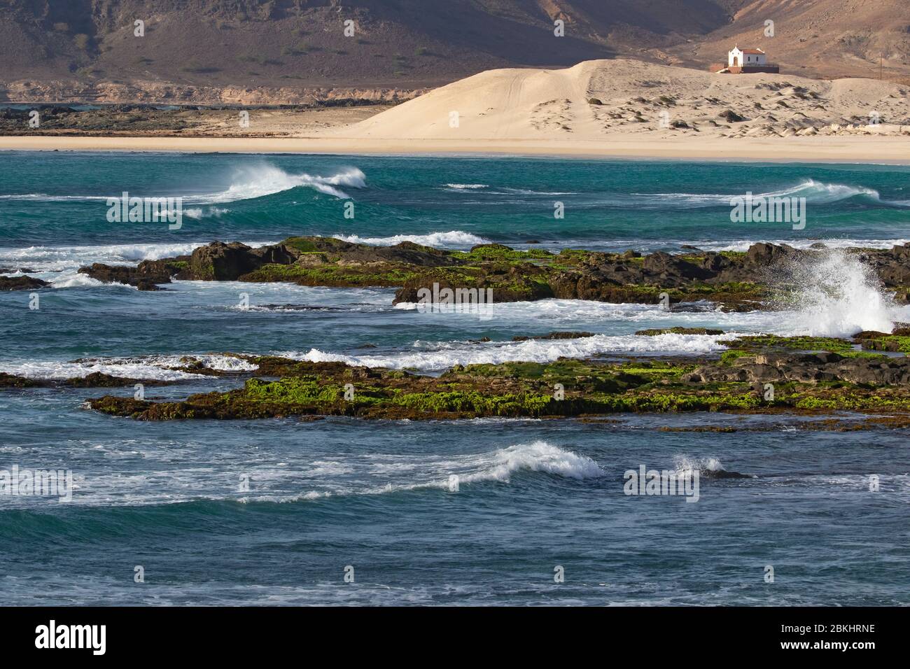 Praia de Fátima and abandoned chapel of Our Lady of Fatima looking over the rugged coast and cliffs near Sal Rei on the island Boa Vista, Cape Verde Stock Photo