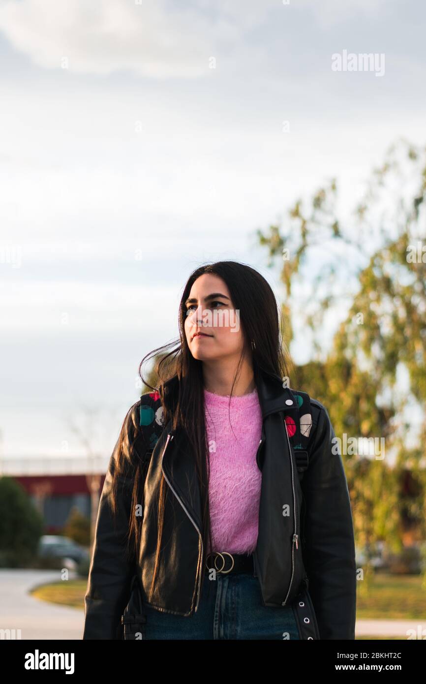 Portrait of a university student walking on the campus Stock Photo - Alamy