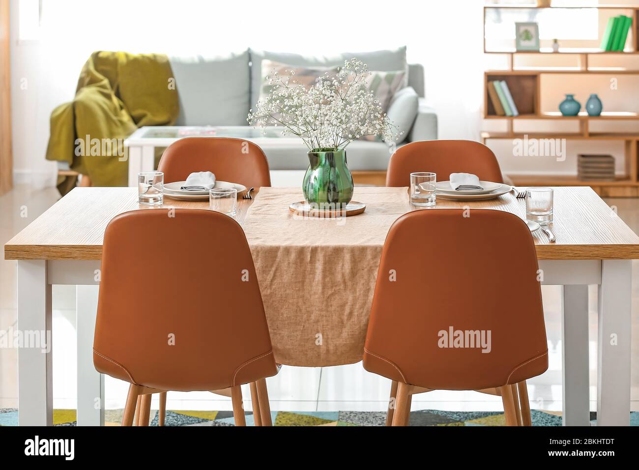 Served table in modern dining room Stock Photo