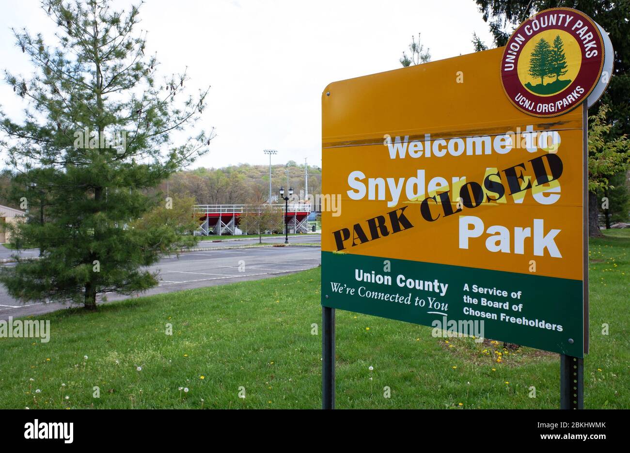 'Park closed' warning sign place over the sign board of Snyder Ave Park during covid-19 coronavirus pandemic outbreak.Berkeley Heights.New Jersey.USA Stock Photo