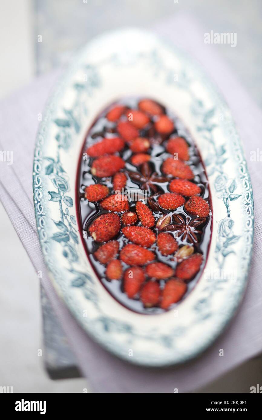 Wild strawberries in red wine syrup Stock Photo Alamy