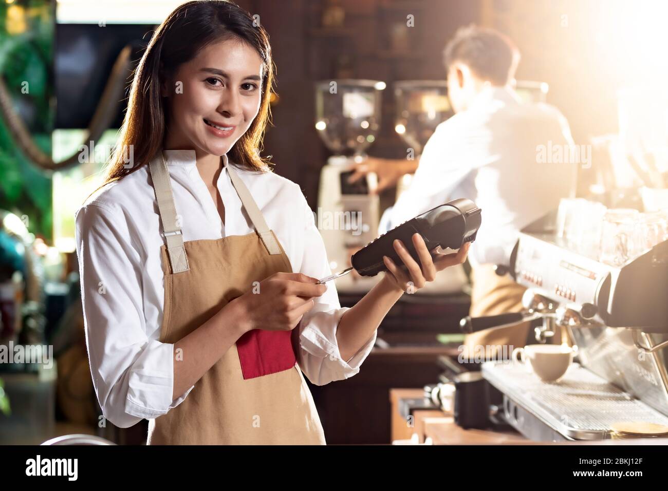 Asian Barista Woman Make Payment With Customer Credit Card Using Emv Chip Technology For Coffee Purchase At A Cafe Bar Cashless Preventing From Coron Stock Photo Alamy