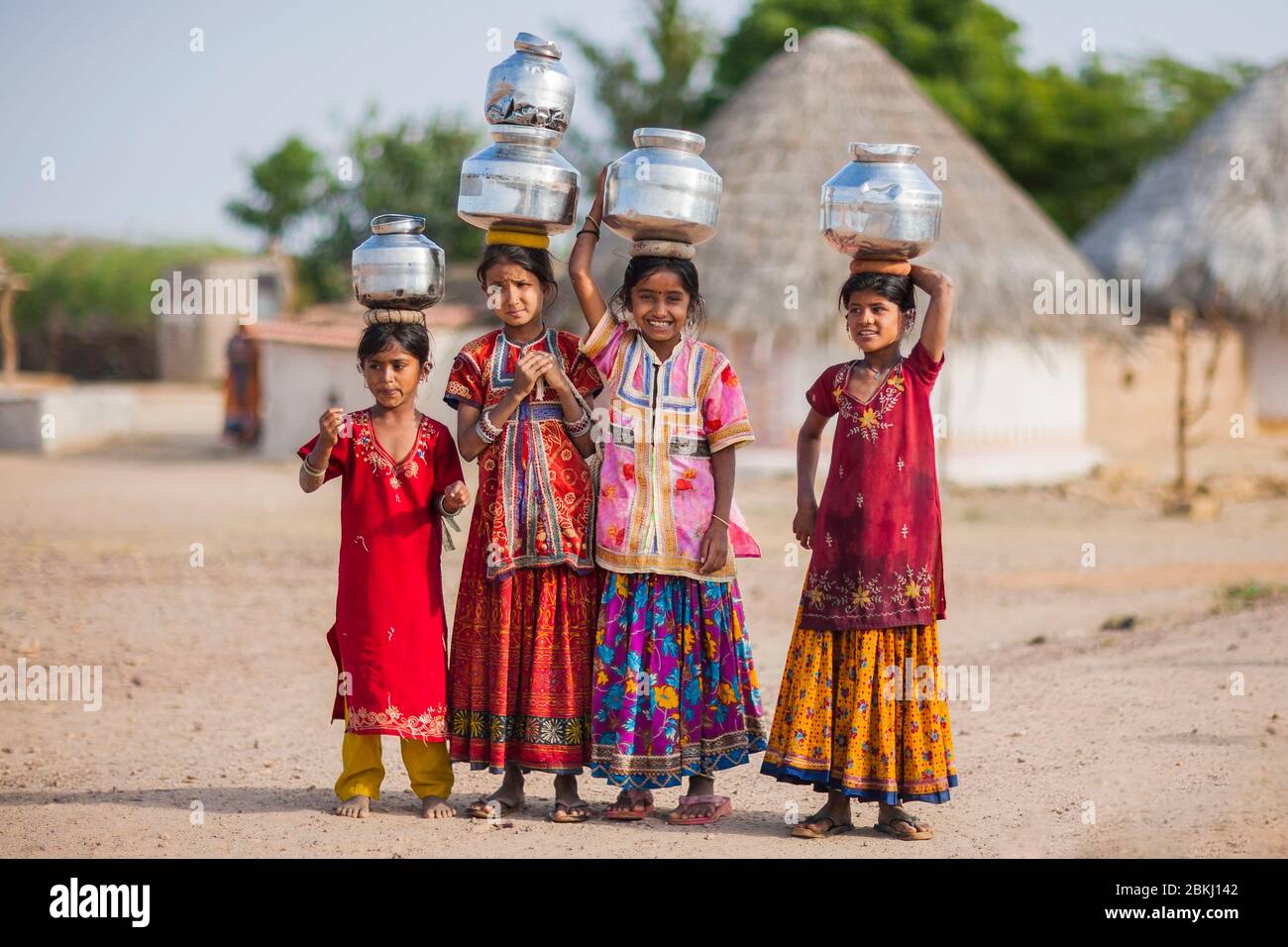 India, Gujarat State, Kutch region, Ludiya village, near Bhuj, group of Meghwal girls carrying pots of drinking water on their head Stock Photo