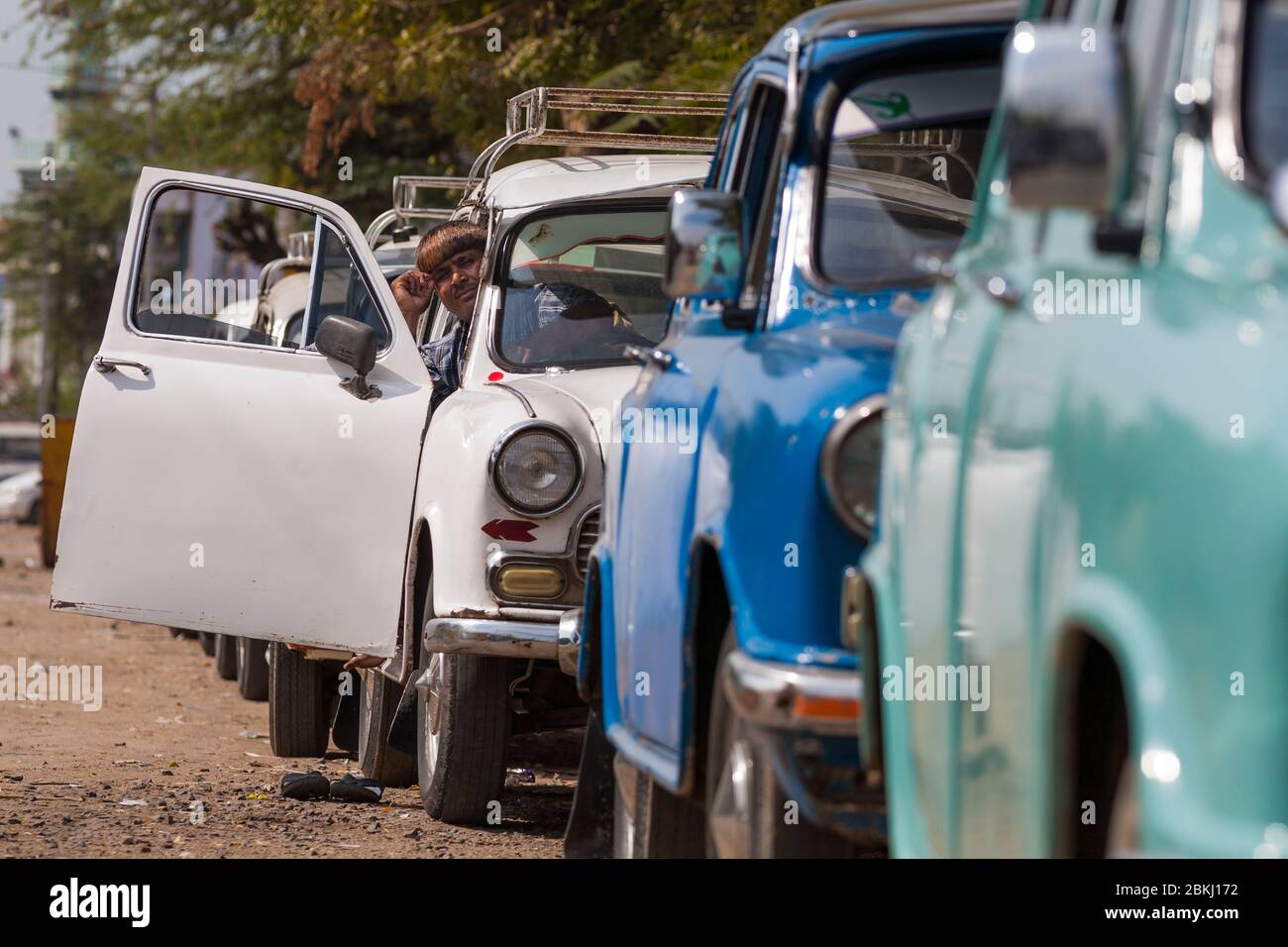 India, Gujarat State, Mandvi, line of Ambassador brand taxis, the first automobile manufactured in India, by Hindustan Motors, from 1958 to 2014 Stock Photo