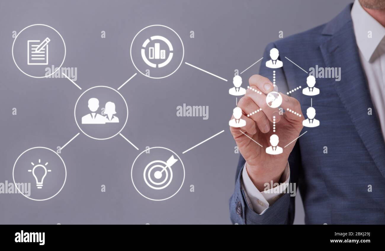 Unrecognizable entrepreneur touching white icons on interactive screen Stock Photo