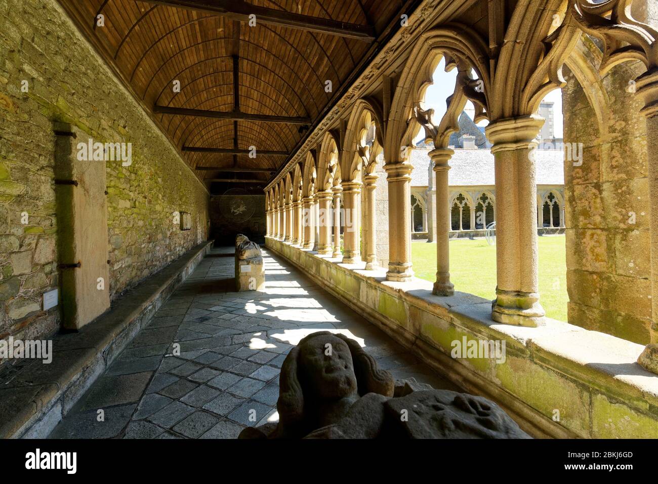 France, Cotes d'Armor, Treguier, Saint-Tugdual cathedral, the cloister in flamboyant gothic style from 1461 and recumbent statue Stock Photo