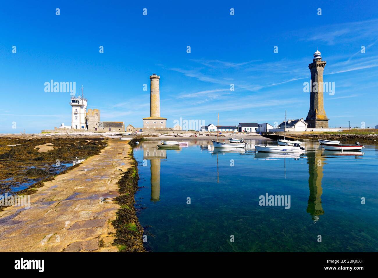 France, Finistere, Penmarch, St Pierre harbour, Eckmuhl lightouse ont the right, former lighthouse and semaphore left Stock Photo