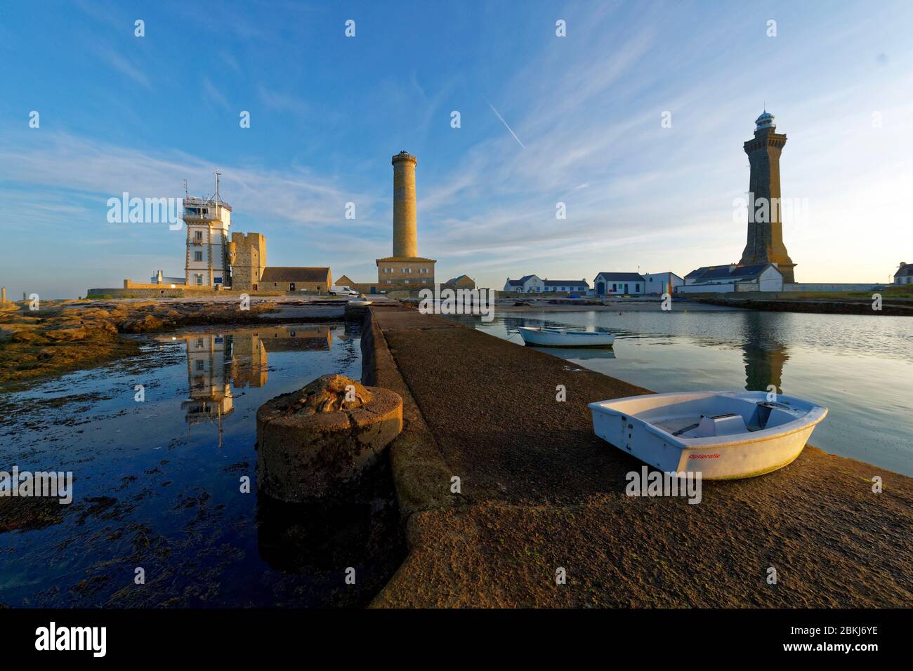 France, Finistere, Penmarch, St Pierre harbour, Eckmuhl lightouse ont the right, former lighthouse and semaphore left Stock Photo