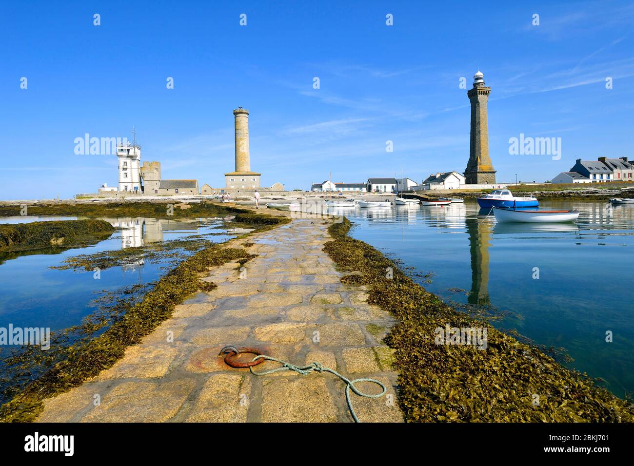 France, Finistere, Penmarch, St Pierre harbour, Eckmuhl lightouse ont the right, former lighthouse and semaphore left Stock Photo