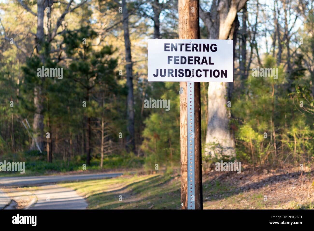A sign displaying "Entering Federal Jurisdiction" by the side of the
