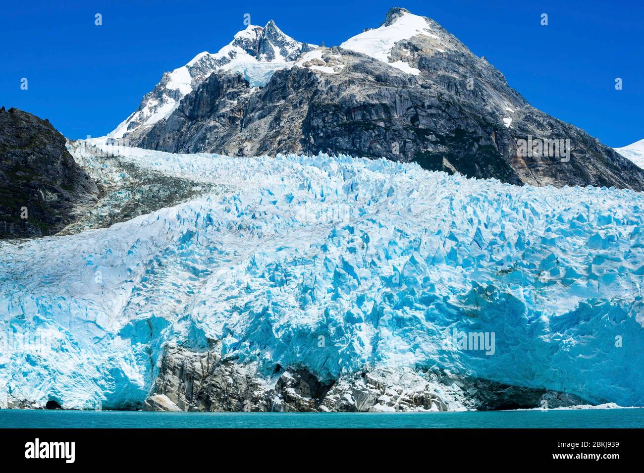 Chile, Patagonia, Aysen, Coyhaique, the titanic blue ice front of the Nevado Leones, high above several buildings, is best seen from a zodiac, at a respectable distance Stock Photo