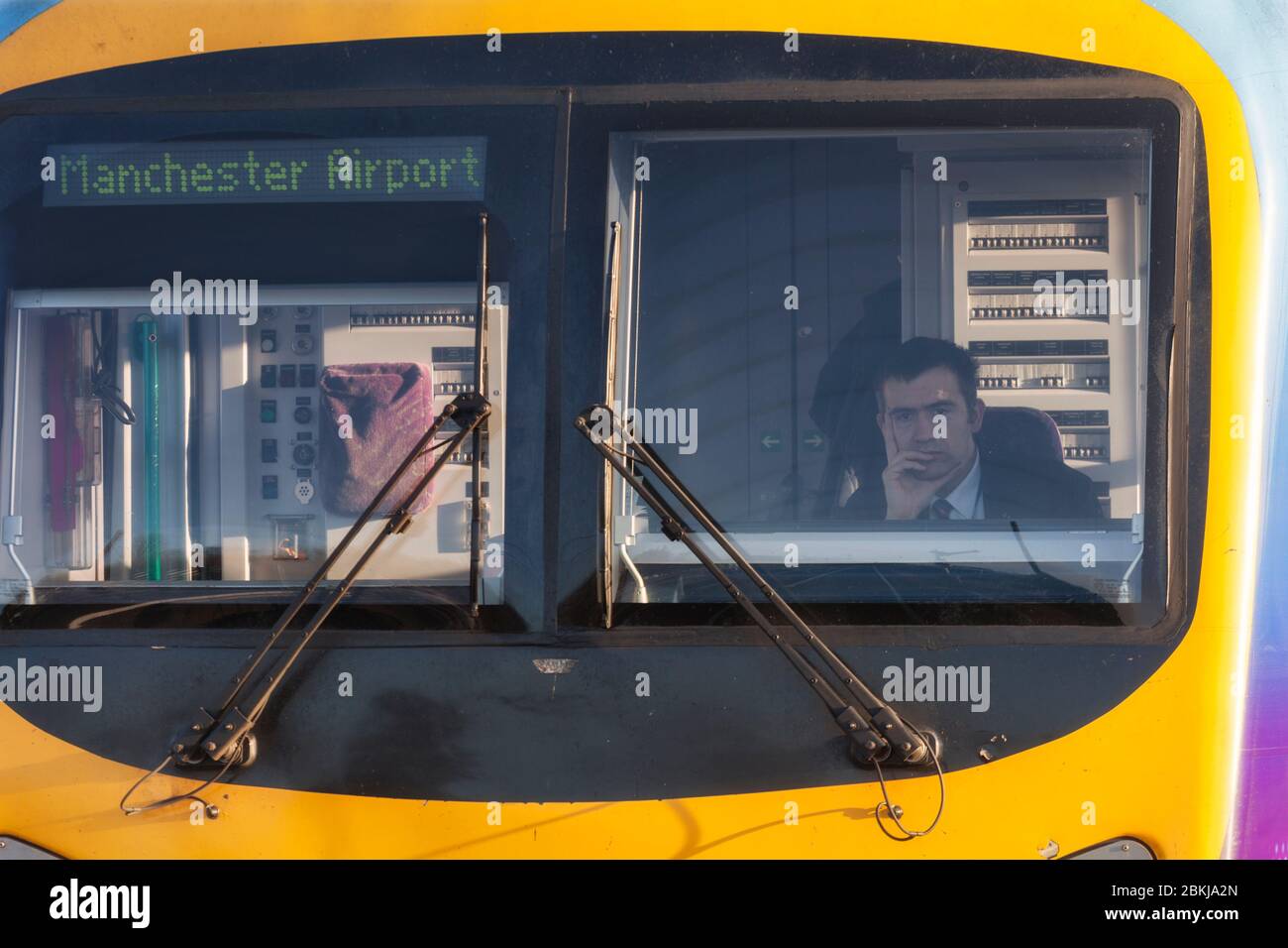 Train driver in the cab of a First Transpennine Express Siemens Desiro UK class 185 train Stock