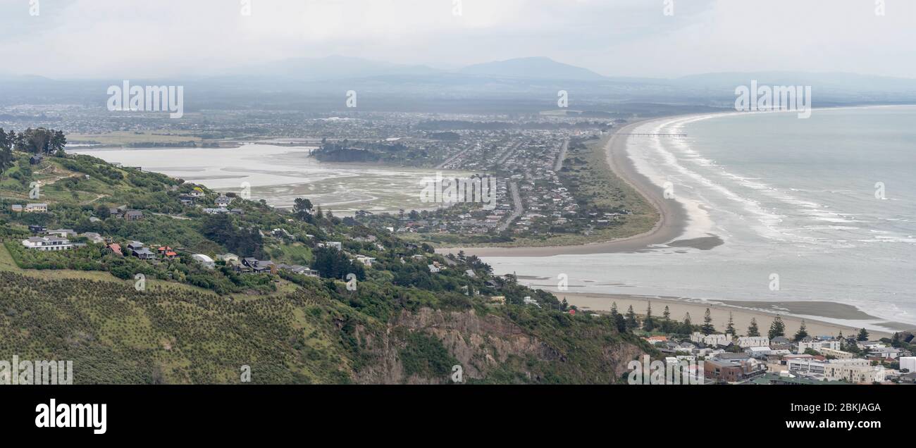 aerial with Ocean waves at Southshore  beach, shot in bright cloudy light from south, Christchurch, South Island, New Zealand Stock Photo