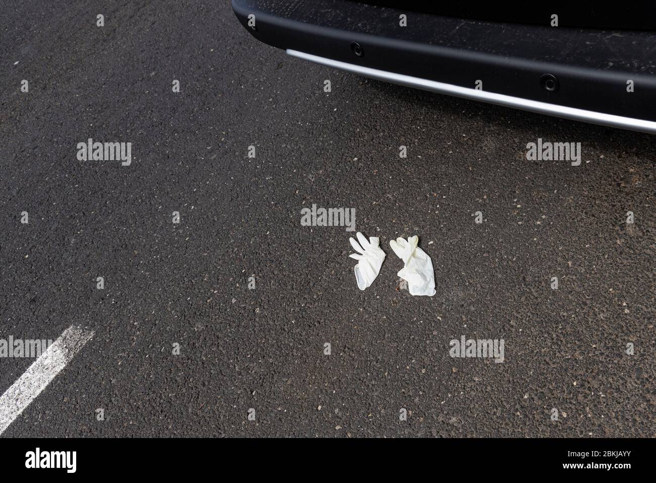 Discarded plastic gloves on the road during the covid 19 lockdown in the tourist resort area of Costa Adeje, Tenerife, Canary Islands, Spain Stock Photo