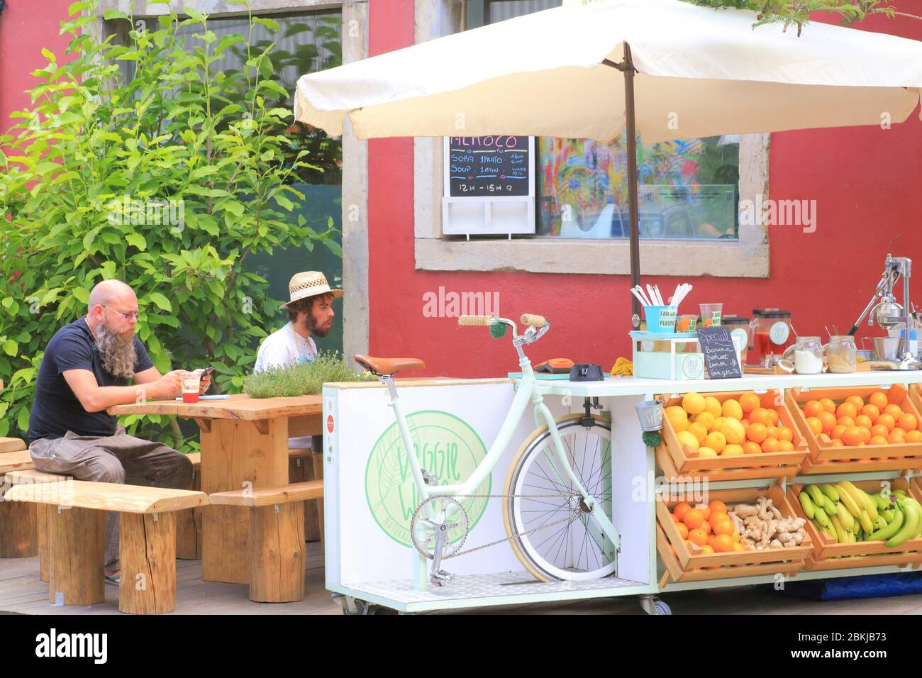 Portugal, Lisbon, Alcantara district, LX Factory located in a former industrial area of ??23,000 m2, seller of fresh and squeezed juice using a bicycle Stock Photo