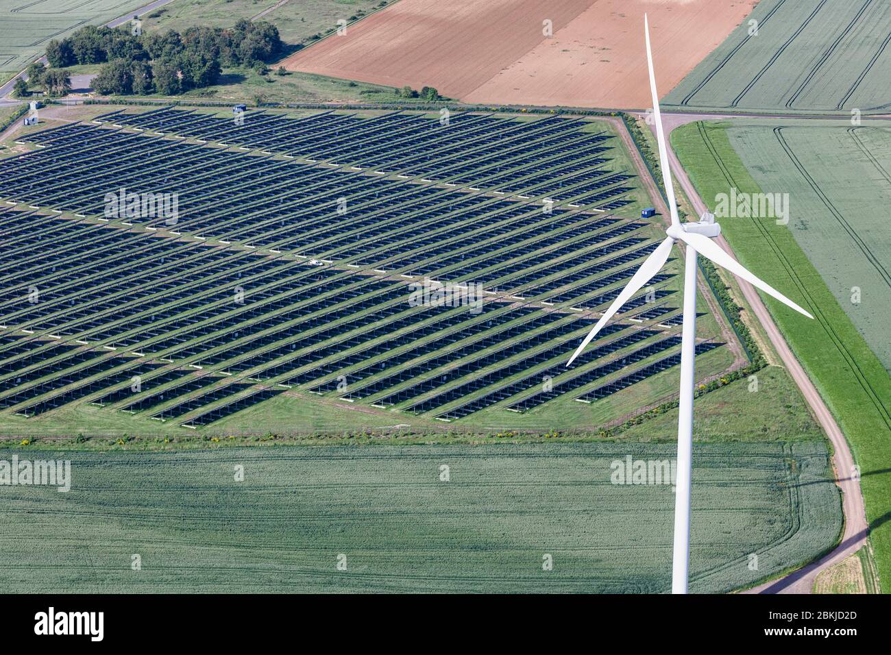 France, Deux Sevres, Thouars, photovoltaic power station and a wind turbine (aerial view) Stock Photo