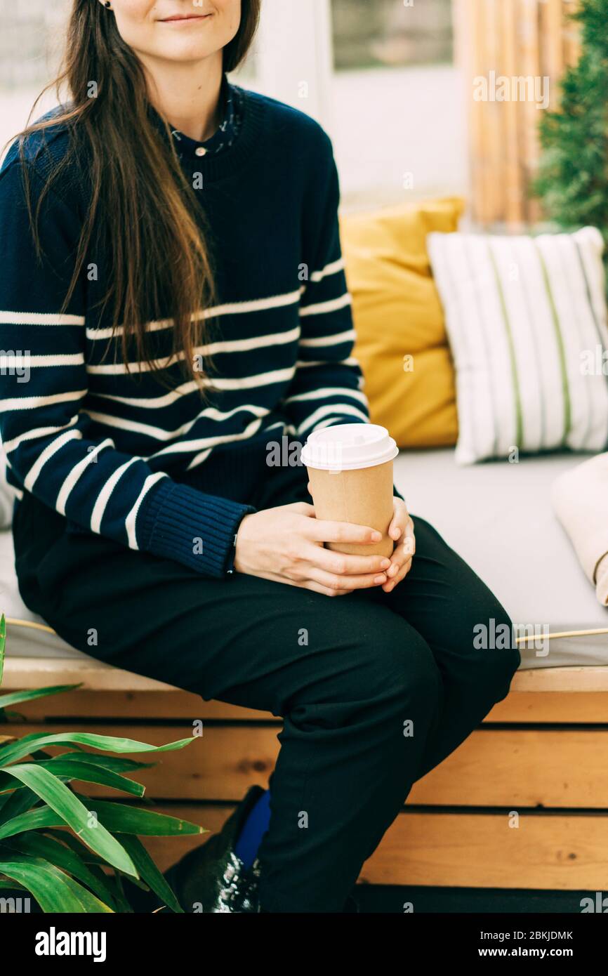 girl with a disposable cup of coffee Stock Photo