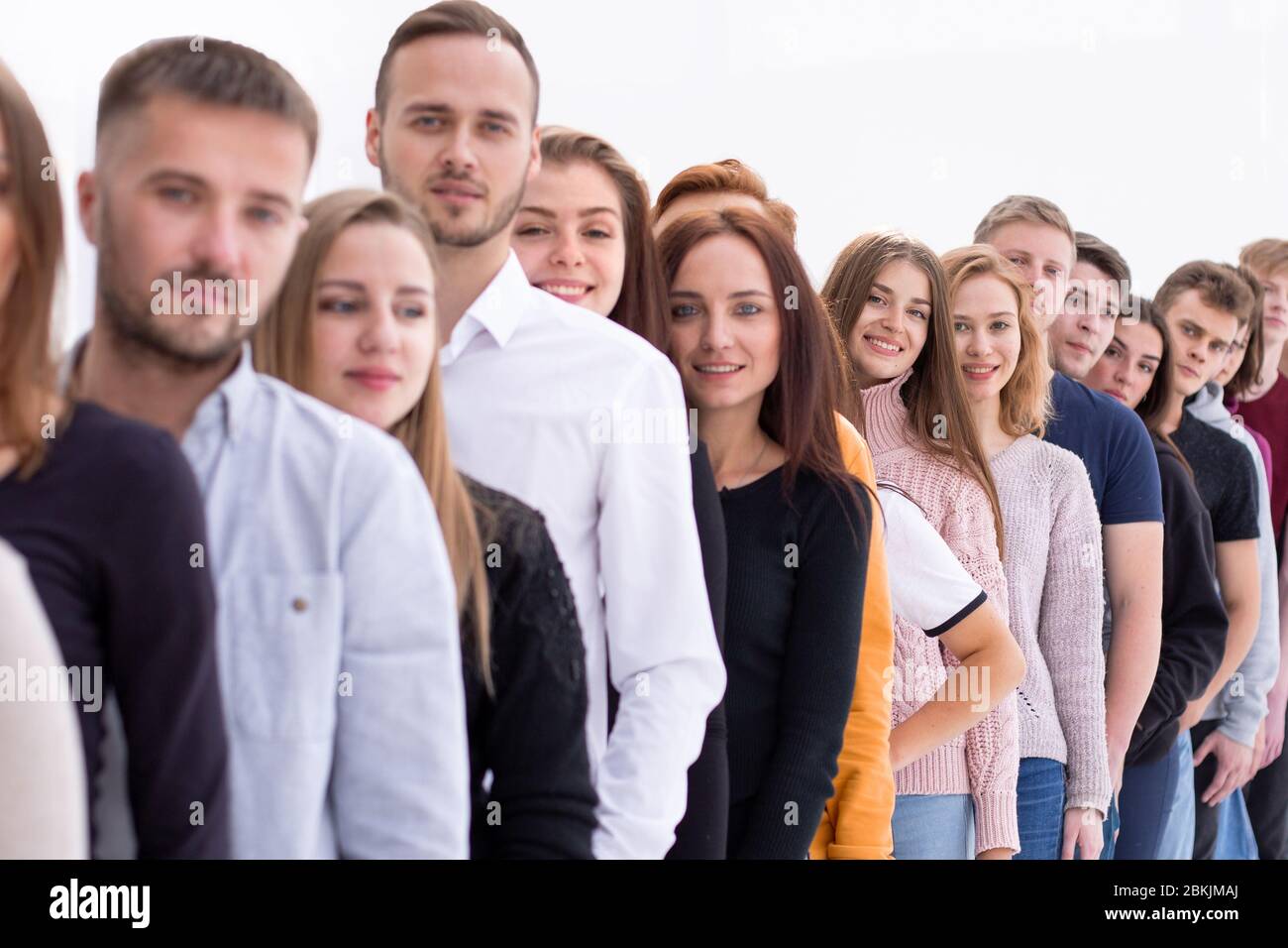 group of diverse young people standing in line Stock Photo - Alamy