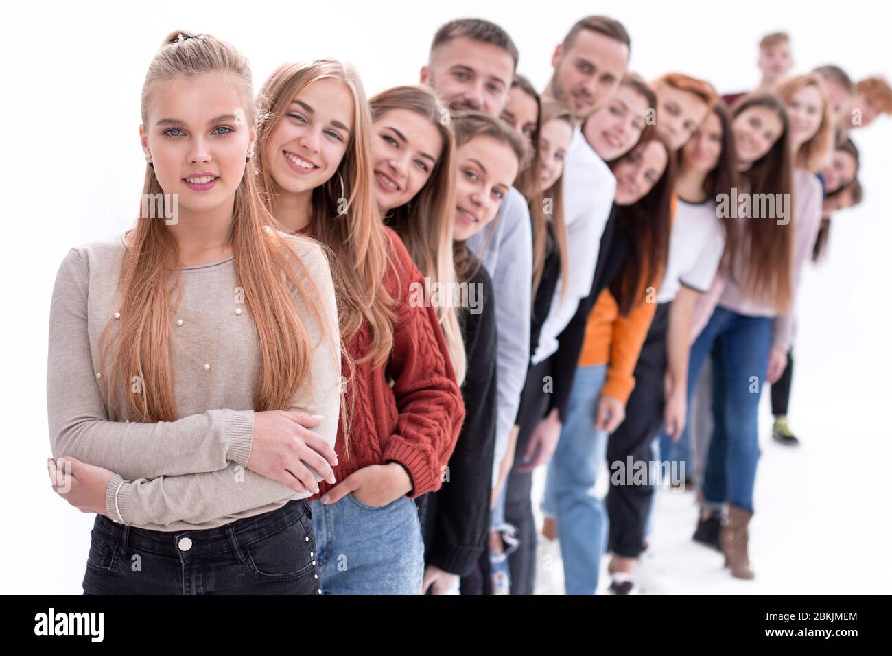 group of happy young people standing in line Stock Photo - Alamy