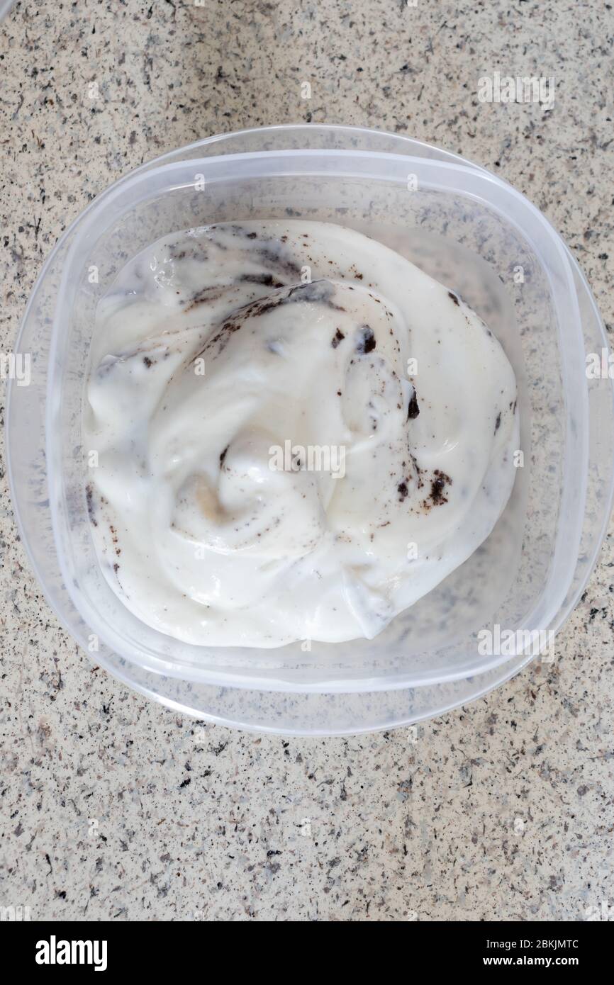 Homemade cookies and cream yogurt put into individual containers on a