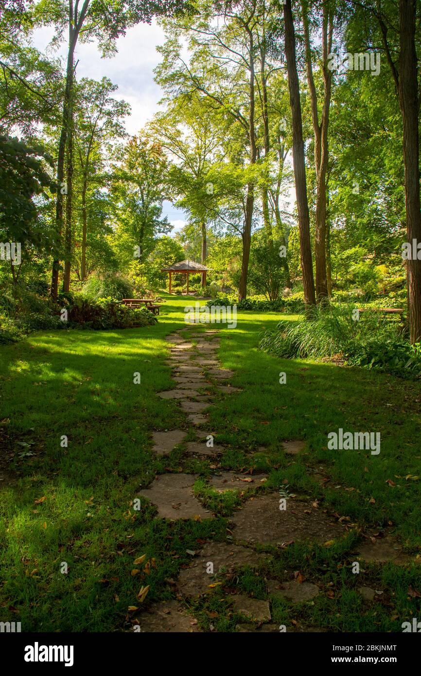 A trail on a sunny day in the Krider World’s Fair Garden in Middlebury, Indiana. Stock Photo