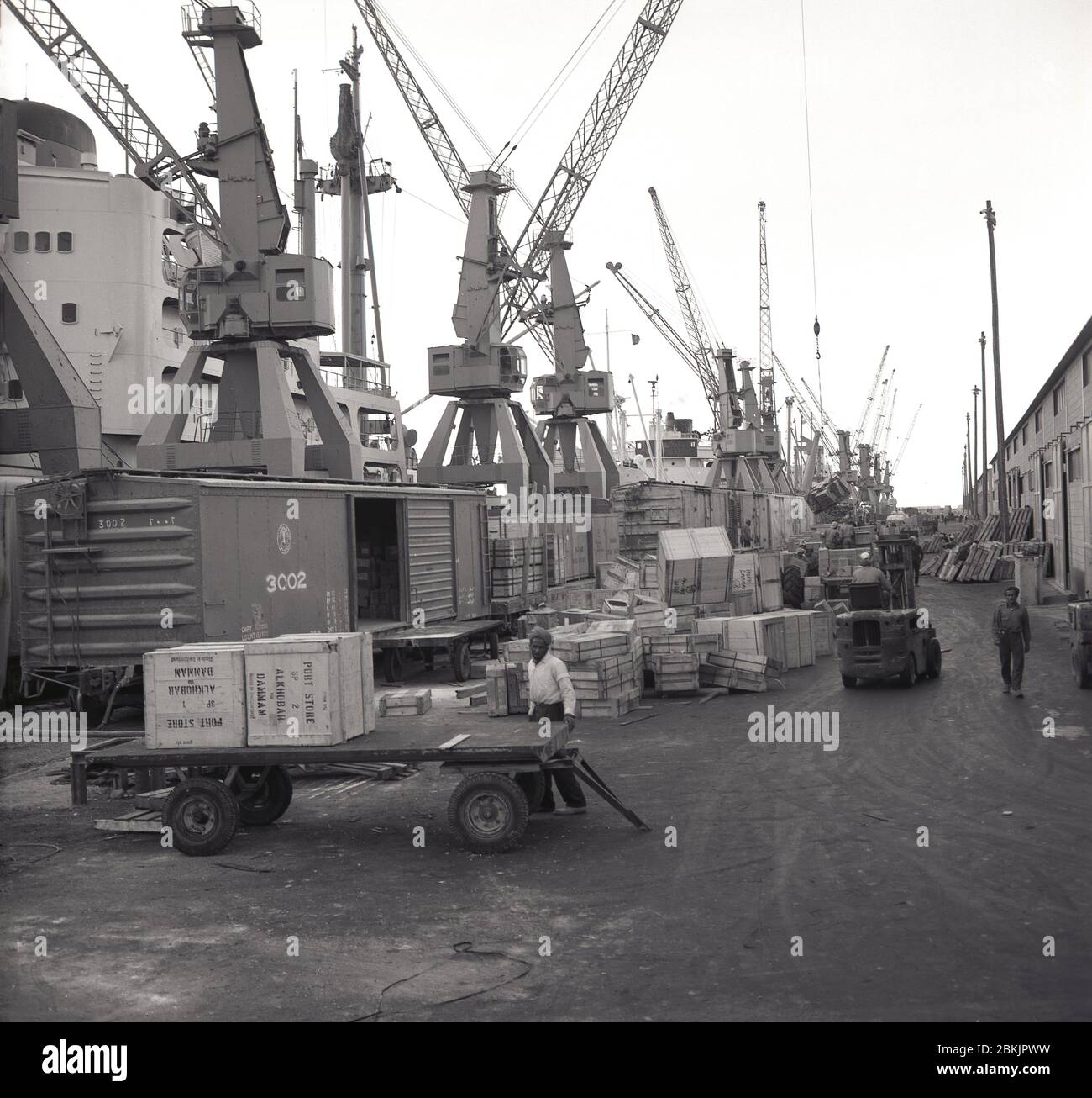 1960s, historical, activity, docks, Dammam, Saudi Arabia, freight being loaded onto a trailer. Stock Photo