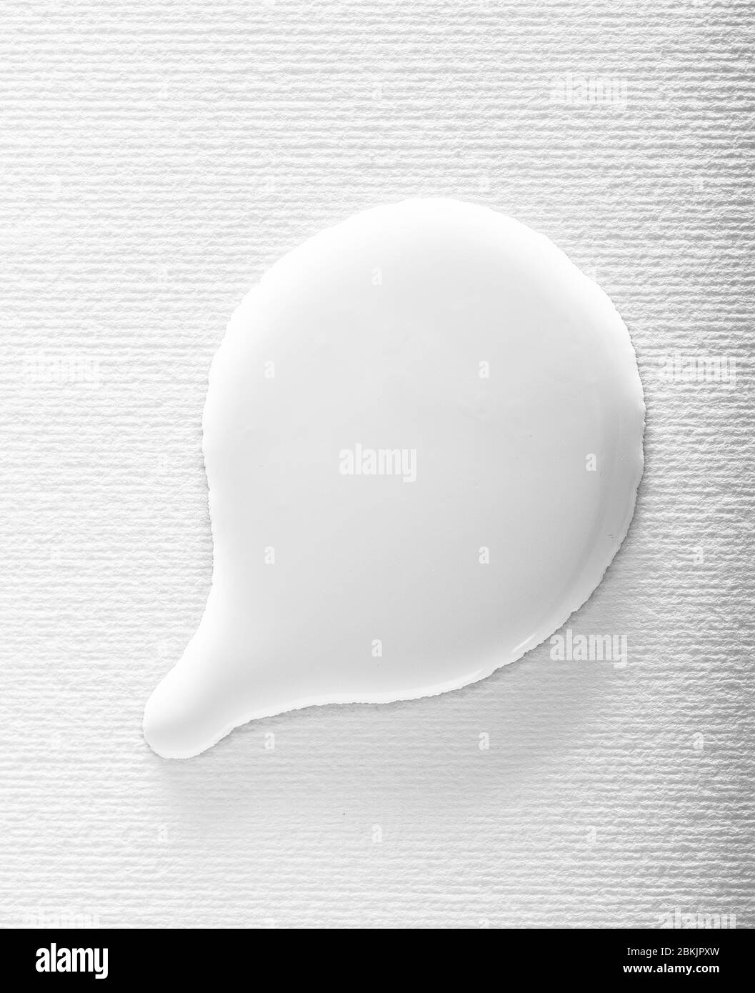 White paint textured bubble on a white background. Abstract wet liquid speech bubble shape Stock Photo