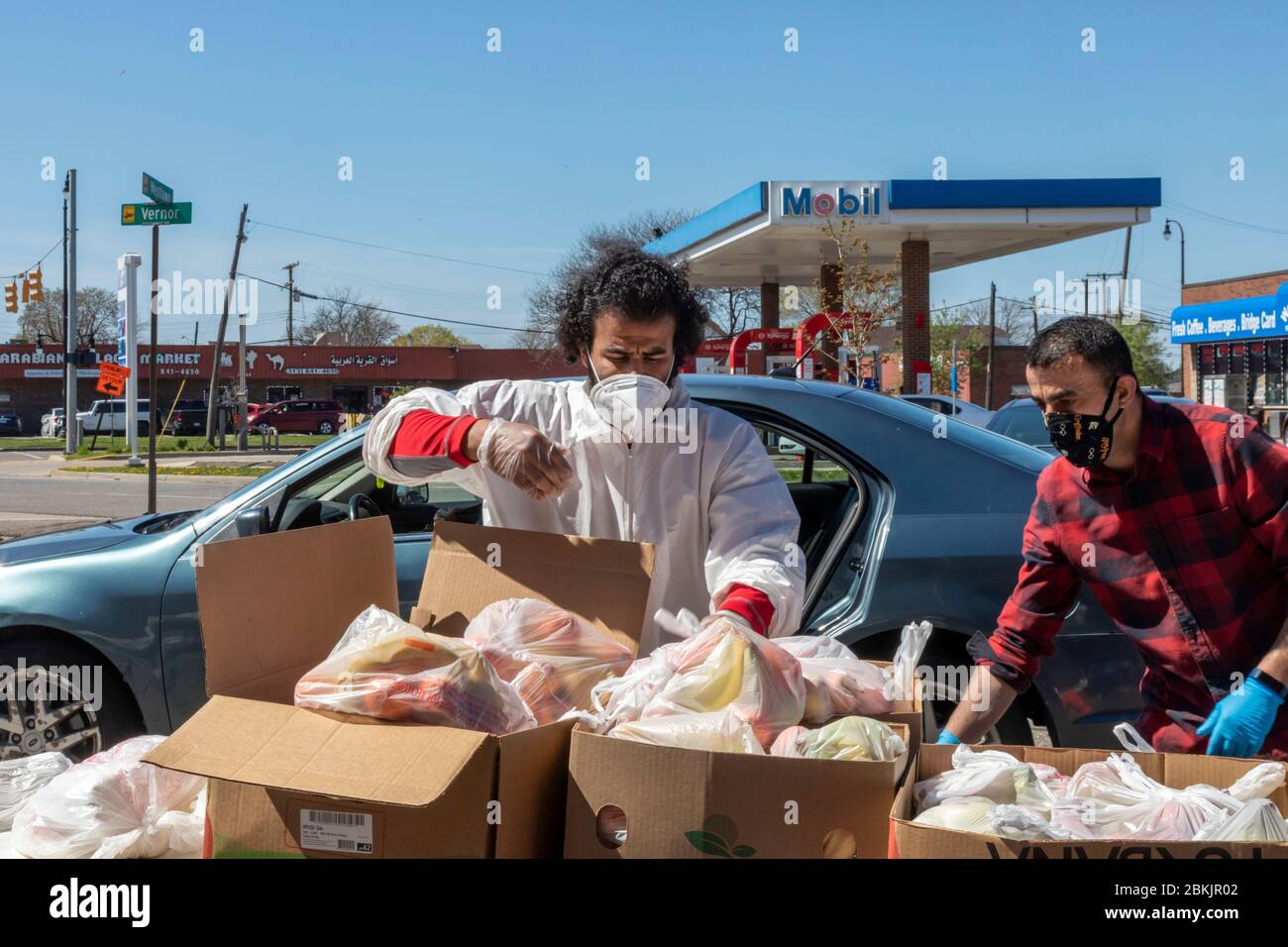Dearborn, Michigan - During the coronavirus pandemic, a long line of cars waited for food for children distributed at the American Moslem Society mosq Stock Photo