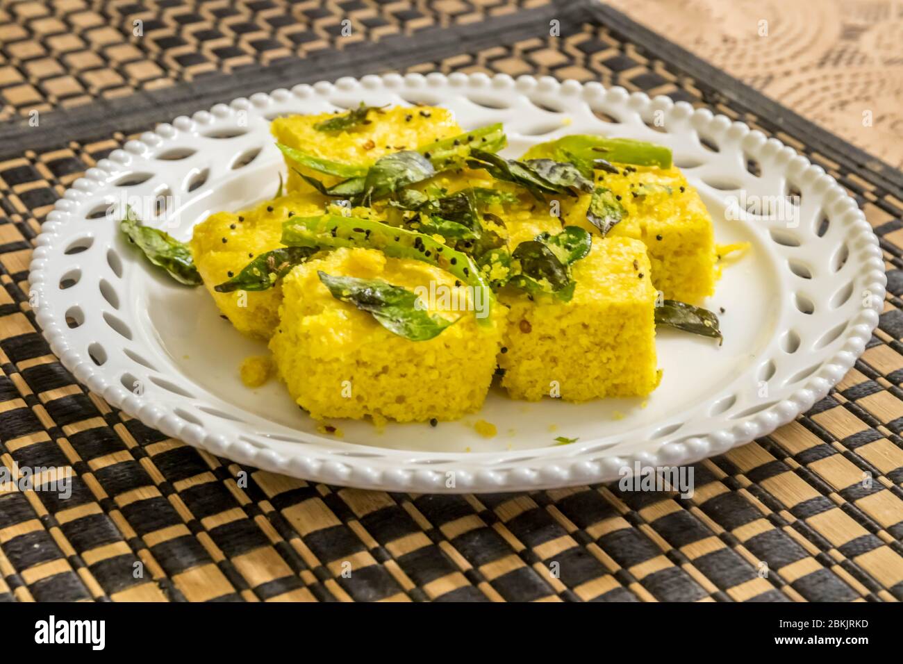 Dhokla famous dish in gujarat being served on the dinning table Stock Photo