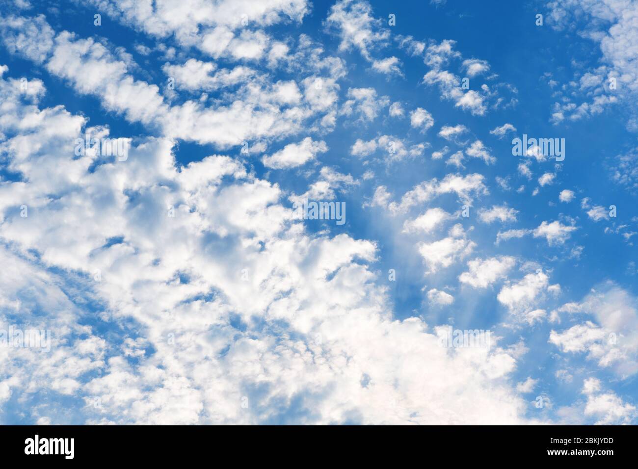 Blue sky with white cloud. Sky background with tiny clouds. Stock Photo