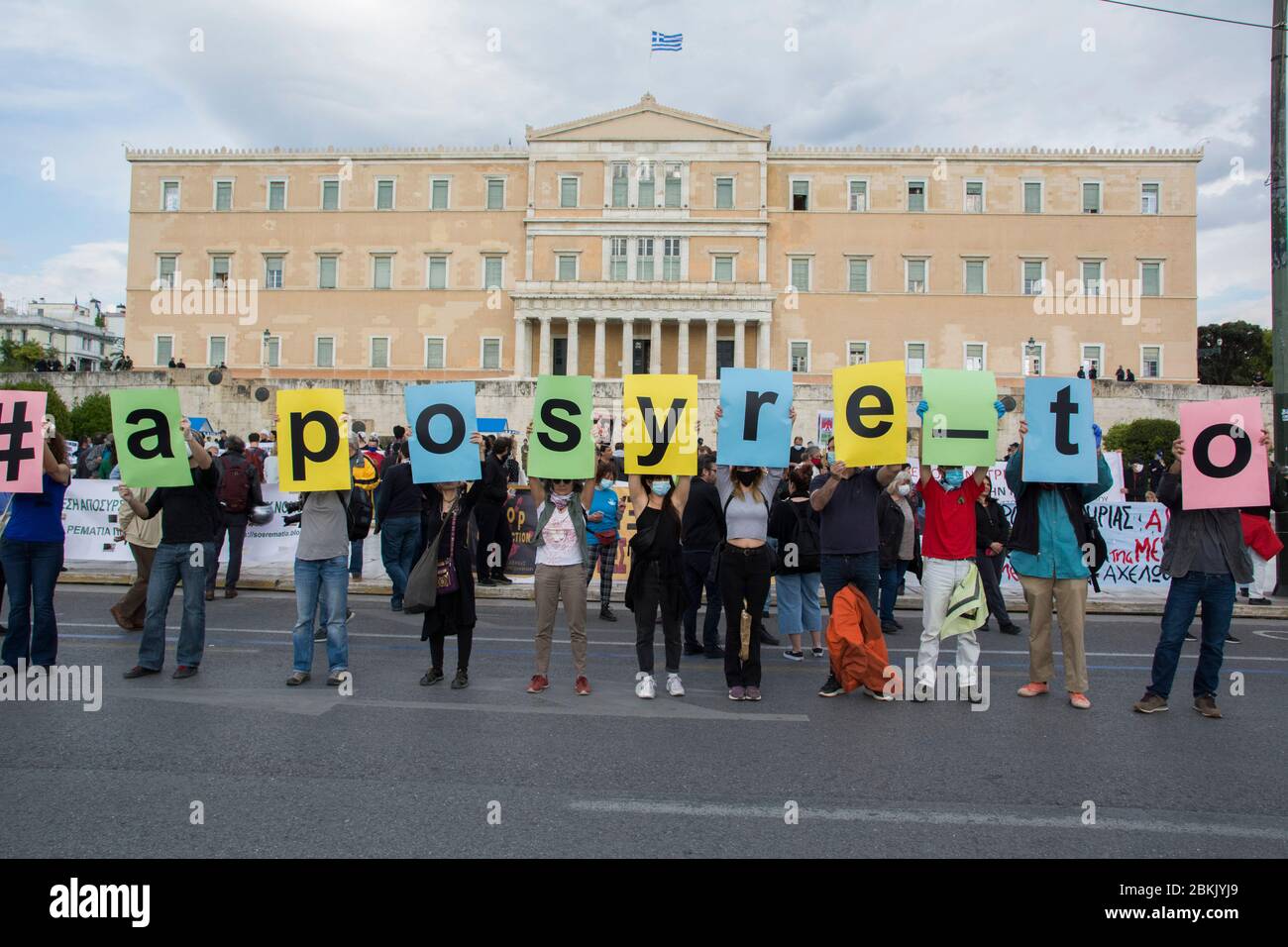 Athens, Greece. 4th May 2020. Protesters hold signs that make the word, '#aposyre to' meaning in greek, 'Take it back' refering to the environmental bill. Protesters hold placards and banners bearing messages such as against oil drilling, mining and wind farms. Hundreds gathered in front of the parliament to demonstrate against the government's environmental draft bill that lifts restrictions and as activists and environmental organizations claim will seriously endanger the environment. Credit: Nikolas Georgiou/Alamy Live News Stock Photo