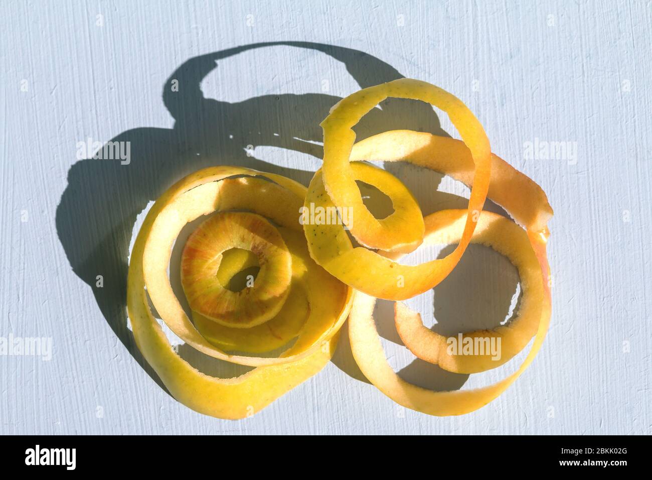 view from above yellow apple with a hard sunlight and deep shadow on a ...