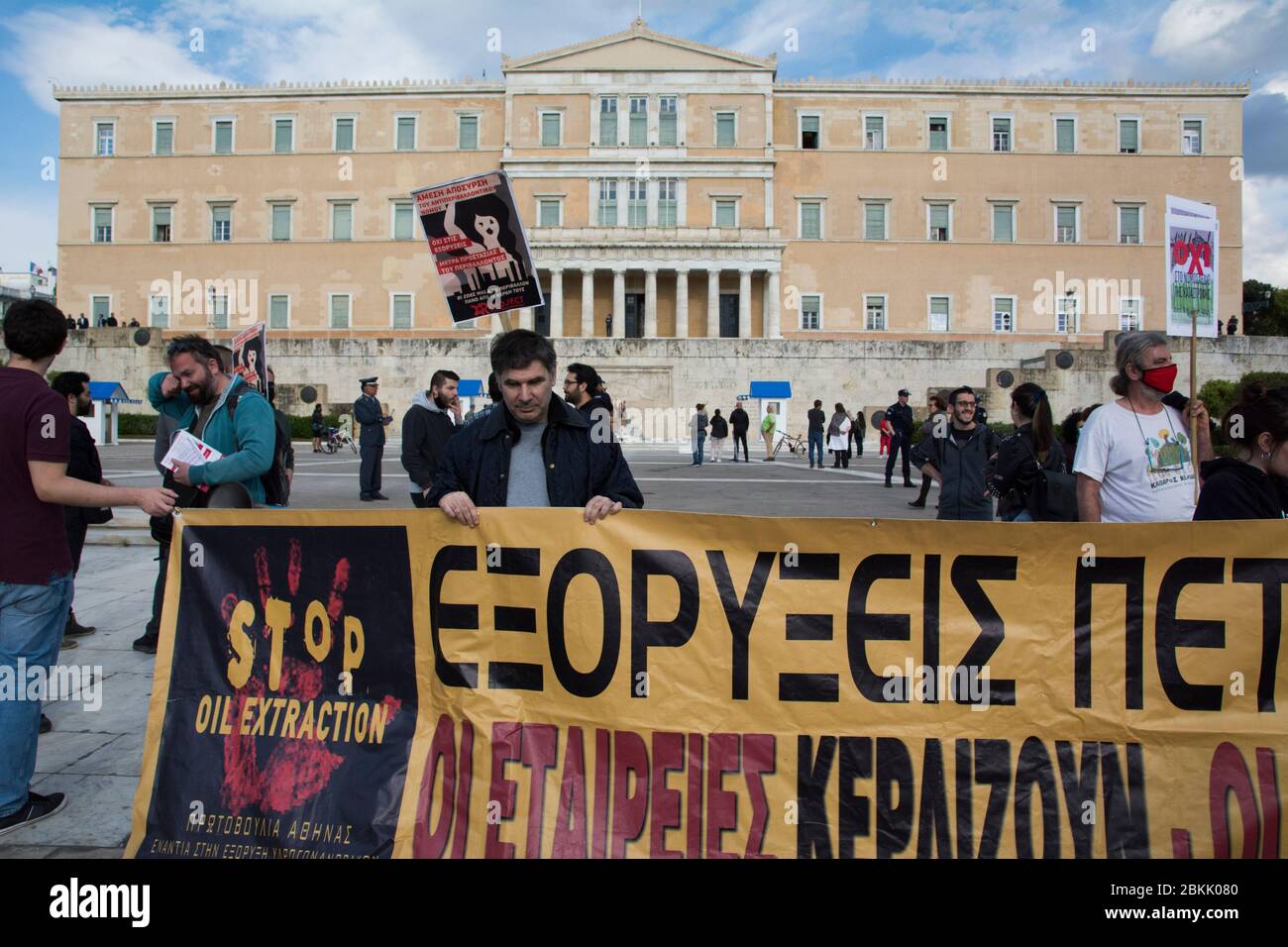 Athens, Greece. 4th May 2020. Protesters hold placards and banners bearing messages such as against oil drilling, mining and wind farms. Hundreds gathered in front of the parliament to demonstrate against the government's environmental draft bill that lifts restrictions and as activists and environmental organizations claim will seriously endanger the environment. Credit: Nikolas Georgiou/Alamy Live News Stock Photo
